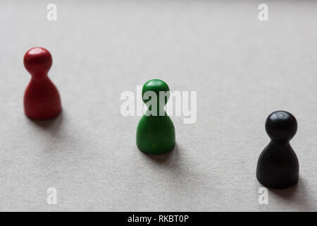 Wooden figures in different colors Stock Photo