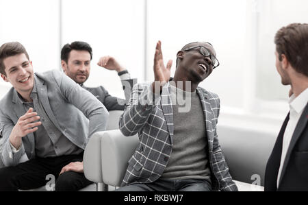 close up.cheerful co-workers giving each other a high five.photo with copy space Stock Photo