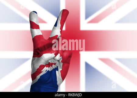 Hand making victory sign, united kingdom painted with flag as symbol of victory, Stock Photo