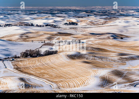 Snow Covered Farmland In The Rolling Hills Of The Palouse From Steptoe Butte. Stock Photo