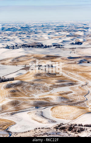 Snow Covered Farmland In The Rolling Hills Of The Palouse From Steptoe Butte. Stock Photo