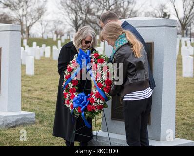 NASA Administrator Jim Bridenstine places a wreath at the Space Shuttle Columbia Memorial with Kristy Carroll, left, and daughter Vivian Carroll who were friends of Space Shuttle Columbia pilot William McCool during the Space Agency Day of Remembrance at Arlington National Cemetery February 7, 2019 in Arlington, Virginia.  Wreaths were laid in memory of those men and women who lost their lives in the quest for space exploration. Stock Photo