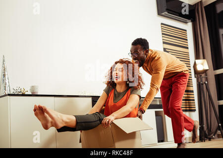 Happy girlfriend feeling memorable moving with her man Stock Photo