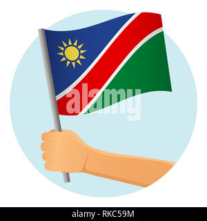 Namibia flag in hand. Patriotic background. National flag of Namibia  illustration Stock Photo