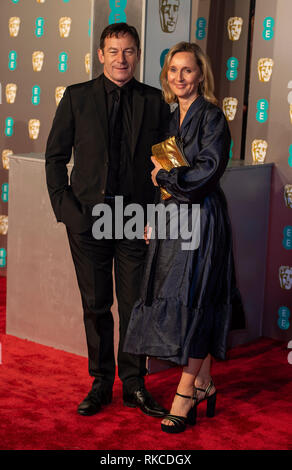 London, UK. 10th Feb, 2019. Jason Isaacs and Emma Hewitt attends the EE British Academy Film Awards at the Royal Albert Hall, London, England on the 10th February 2019 Credit: Gary Mitchell, GMP Media/Alamy Live News Stock Photo