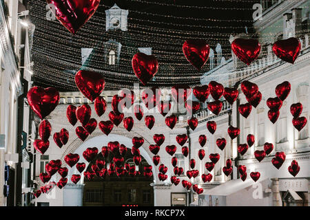 Moscow, Russia - February 9, 2019. Tretyakov Passage decorated with balloons in shape of hearts for Valentine Day– Stock Editorial Photography Stock Photo