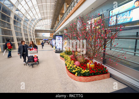 HONG KONG - 29 JANUARY, 2016: inside of Hong Kong International Airport. Hong Kong International Airport is the main airport in Hong Kong. Stock Photo