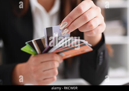 Female arm hold bunch of credit cards Stock Photo