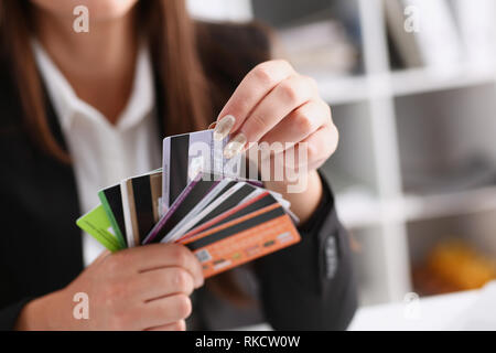 Female arm hold bunch of credit cards Stock Photo