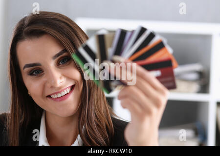 Female arm hold bunch of credit cards Stock Photo