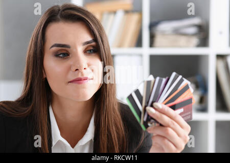 Female arm hold bunch of credit cards Stock Photo