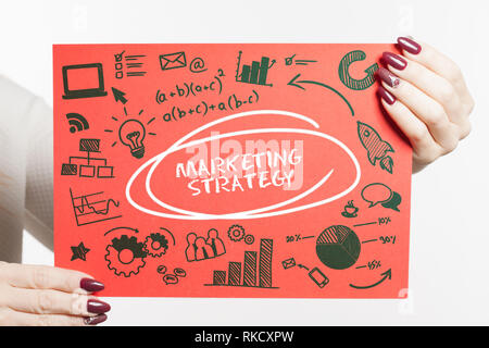 Business, Technology, Internet and network concept. Young businessman shows the word: marketing strategy Stock Photo