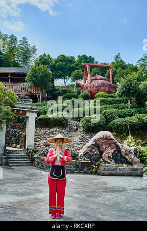 Guangxi, China - September 30, 2014 :Chinese woman in front of traditional tea house  between Guilin and Yangshuo in Guangxi province  China Stock Photo