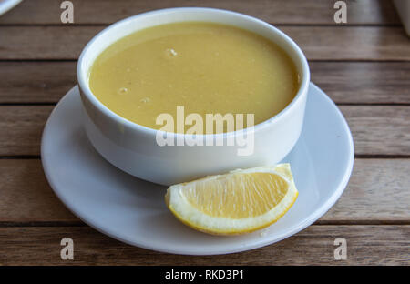 Turkish lentil soup mercimek corbasi, with lemon. Stock Photo
