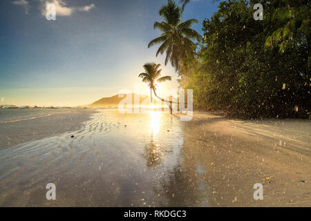 Exotic island at sunrise and in the rain Stock Photo