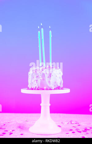 Birthday cake with candles. Birthday party celebration concept. Vertical. Modern surreal pop art toning, creative reality concept Stock Photo