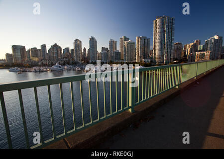 Yaletown skyline from the Cambie Street Bridge over False Creek on a Sunny Day with Deep Blue Skies in Vancouver, British Columbia, Canada Stock Photo