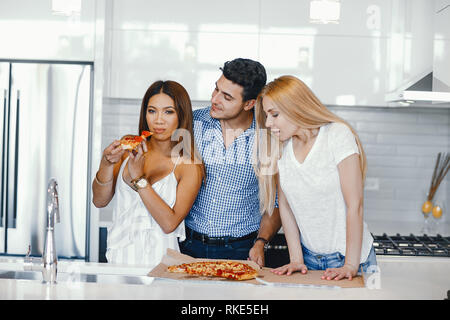 friends eating a pizza Stock Photo
