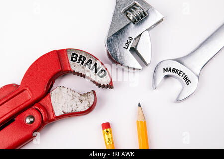 Brand, logo, marketing concept. Plumbing key, abstract advertising and social media background Stock Photo