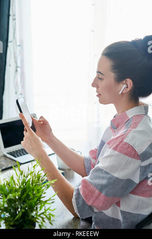 Young Woman Using Mobile Phone Stock Photo