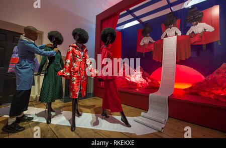 Somerset House, London, UK. 11th Feb, 2019. Designers putting the finishing touches to their display in 16 different room installations at International Fashion Showcase 2019 previews ahead of London Fashion Week. Image: South African fashion designer Thebe Magugu finishes his installation African Studies. Credit: Malcolm Park/Alamy Live News Stock Photo