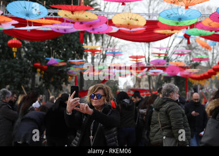 Rome, Italy. 10th Feb, 2019. A woman takes a selfie during the 2019 Spring Festival celebrating event in Rome, Italy, on Feb. 10, 2019. The celebration was held in Rome, Italy for the Lunar New Year, included a parade of lion and dragon dance and a photo exhibition. Thousands of people including local residents, foreign visitors and Chinese communities were attracted. Credit: Cheng Tingting/Xinhua/Alamy Live News Stock Photo