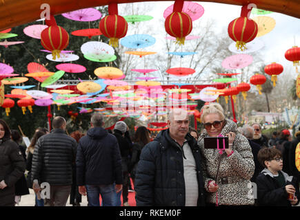 Rome, Italy. 10th Feb, 2019. A couple takes a selfie during the 2019 Spring Festival celebrating event in Rome, Italy, on Feb. 10, 2019. The celebration was held in Rome, Italy for the Lunar New Year, included a parade of lion and dragon dance and a photo exhibition. Thousands of people including local residents, foreign visitors and Chinese communities were attracted. Credit: Cheng Tingting/Xinhua/Alamy Live News Stock Photo