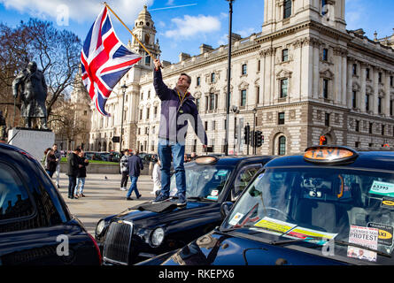 London, UK. 11th Feb, 2019. Licensed taxi Drivers block Parliament Square, Whitehall and surrounding streets. They have brought the area around Westminster to a standstill.They are protesting against the Mayor of London and TFL who have denied them access to Bank, Tottenham Court Road, Tooley Street, Greenwich, Lewisham, Islington and Hackney. They claim that the Mayor of London and TFL are engineering the destruction of the licensed Taxi trade through closing streets to them. Credit: Tommy London/Alamy Live News Stock Photo