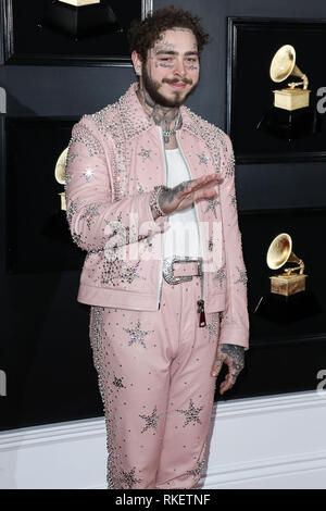 Los Angeles, United States. 10th Feb,  ANGELES, CA, USA - FEBRUARY  10: Rapper Post Malone wearing a custom pink Ashton Michael suit designed  by Catherine Hahn, studded by Star Studded, a