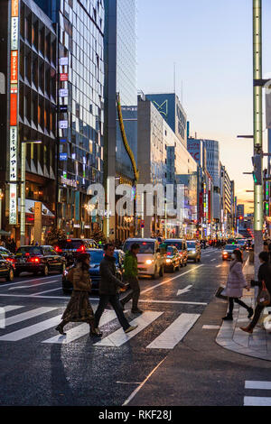 Tokyo, Ginza at golden hour. View along street, Louis Vuitton and the  Bvlgari flagship store buildings with taxis waiting at red stop light in  front Stock Photo - Alamy