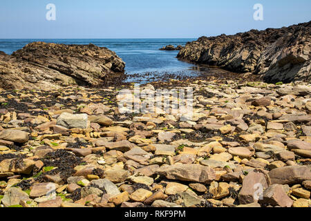 Man made channel (at low tide) for boat delivery of stone and supplies for Fort Houmet Herbe on Alderney. Stock Photo