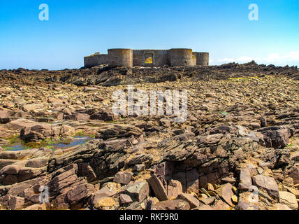 Fort Houmet Herbe on Alderney at low tide. Stock Photo