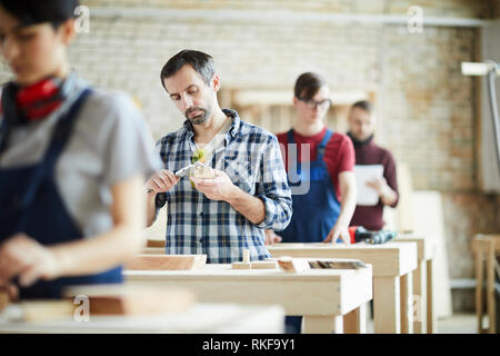 Measuring wooden detail Stock Photo
