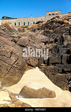 The dominating position of Fort Corblets on Alderney, taken from the beach. Stock Photo