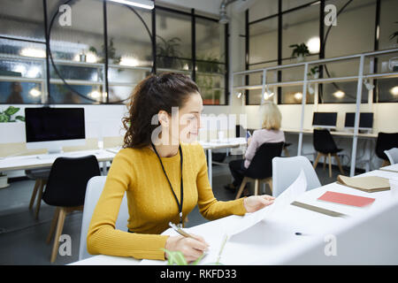 Busy manager checking documents Stock Photo