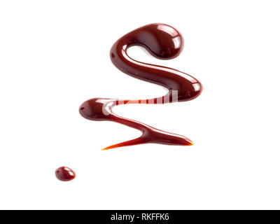 Chocolate sauce on white. Abstract lines made of chocolate or soy sauce isolated on white background Stock Photo