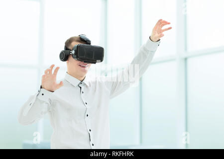 young businessman in virtual reality glasses. people and technology Stock Photo