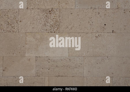 coquina background old fossil.Building blocks from sandstone. Rough texture of bricks made of sand and seashells Stock Photo