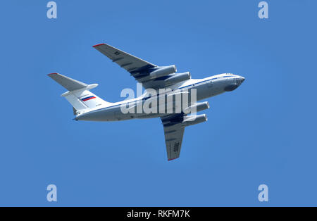 Russian military transport plane IL-76MD (Candid) in clear blue sky in flight on May 9, 2018 in Moscow closeup Stock Photo