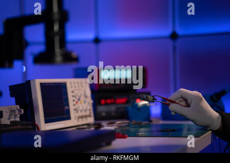 Check electronics device in industrial lab Stock Photo