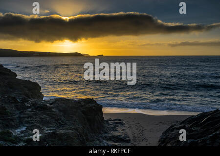 A spectacular sunset over the coast of Newquay in Cornwall. Stock Photo