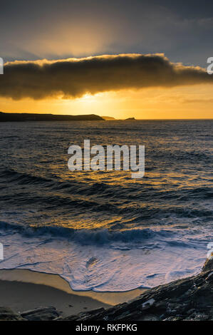 A spectacular sunset over the coast of Newquay in Cornwall. Stock Photo