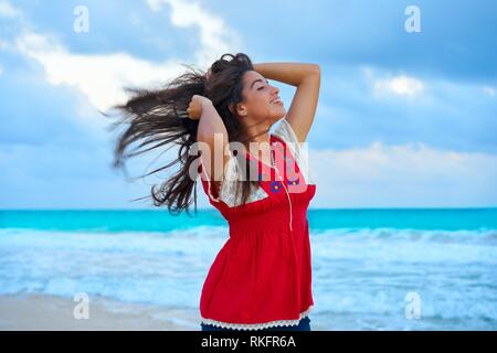 https://l450v.alamy.com/450v/rkfr6a/mexican-girl-embrodery-dress-at-sunset-in-caribbean-sea-rkfr6a.jpg