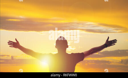 Silhouette of Business man Celebration Success Happiness on Sunset Evening Sky Background Stock Photo