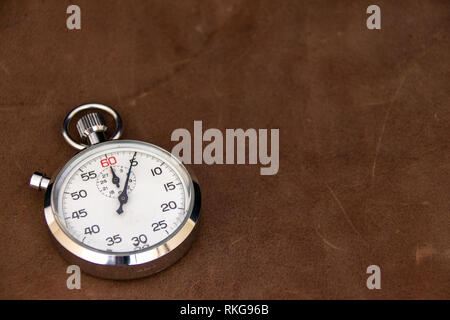 Stopwatch on leather background Stock Photo