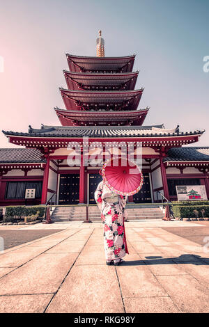 Girl with traditional dress in Senso-ji temple in Asakusa, Tokyo