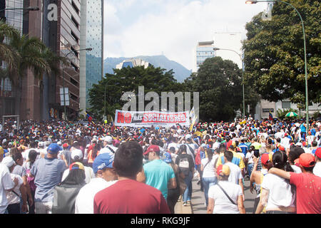 Venezuelan people protesting in Caracas against Nicolás Maduro and supporting Juan Guaidó 2019 Stock Photo