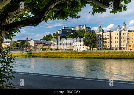 View of the Old Town across the Salzach river with the Dom Cathedral and Hohensalzburg Fortress in the distance, Salzburg, Austria. Stock Photo