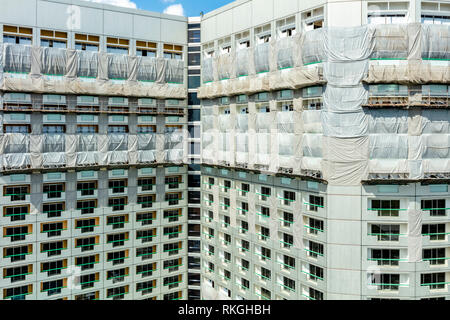 Exterior building facade of Fairmont Hotel at Raffles City Singapore renovation in progress 2019 Stock Photo