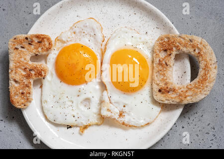 Word food written with toast letters eggs Stock Photo